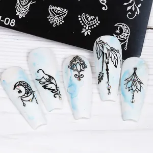 Detailed view of white and blue marble press-on nails with ethnic moon and feather patterns