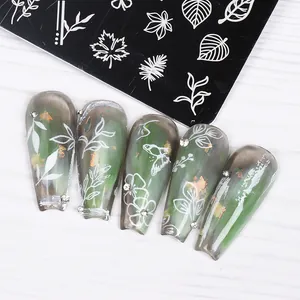 Detailed view of floral nail stamping plate with marble coffin fake nails