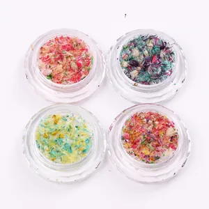 Set of 4 jars with assorted colorful dried flowers for nail art and DIY resin crafts