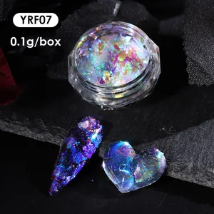 Macro shot of iridescent aurora nail powder YRF07 with holographic shimmer on a long nail tip