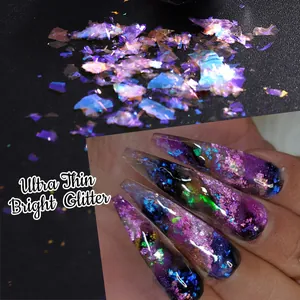 Macro view of ultra thin iridescent nail glitter flakes with holographic laser effect