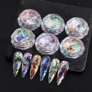 Detailed view of iridescent aurora nail glitter flakes set with six colorful sample tips