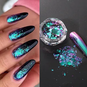Irregular chameleon nail glitter flakes showing iridescent purple and blue shifts on dark base