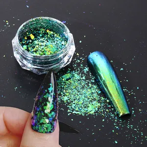 Chameleon aurora nail glitter with iridescent blue-green metallic flakes in a clear jar