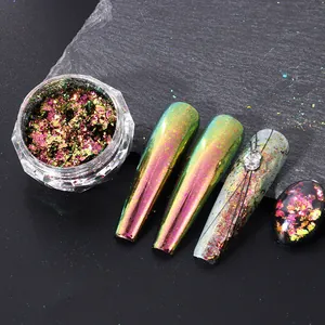 Detailed view of chameleon nail flakes showing iridescent green and gold shifts on tips