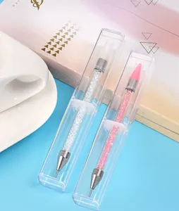 Close-up of dual-ended nail art dotting tools with crystal-filled acrylic handles