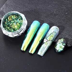 Macro shot of chameleon nail glitter flakes with iridescent yellow-green gradient finish