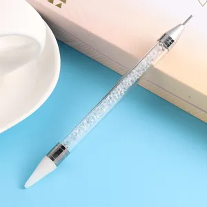 Dual-ended nail dotting tool with acrylic crystal-filled handle and wax tip closeup
