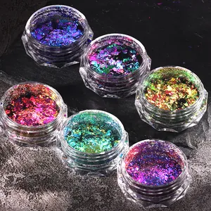 Detailed view of six jars of iridescent chameleon nail glitter with laser aurora effect