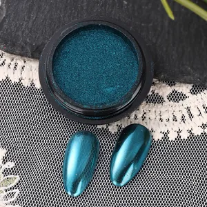 Detail of peacock blue chrome nail powder with metallic mirror finish and swatch plates
