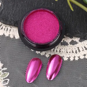 Macro shot of fuchsia chrome nail powder with metallic mirror finish on sample nails
