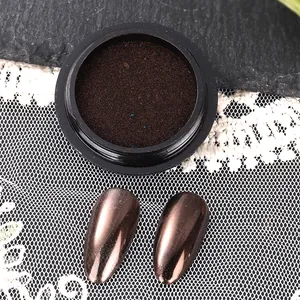 Macro view of holographic nail mirror powder in bronze with metallic finish nail tips