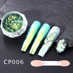 Macro view of iridescent chameleon nail glitter flakes with applicator brush