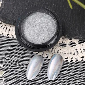 Detail of silver laser nail mirror powder showing metallic chrome effect and aurora shine