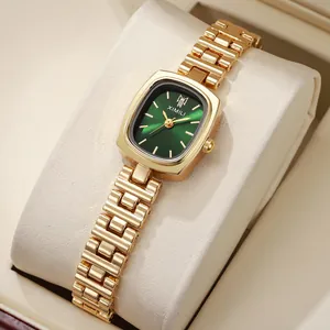 Montre dorée élégante pour femme avec cadran vert émeraude et bracelet à maillons en H