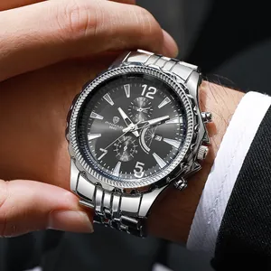 Macro detail of men's chronograph watch with silver steel strap and black dial