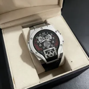 Men's tonneau-shaped quartz watch with silver metal case and black silicone strap