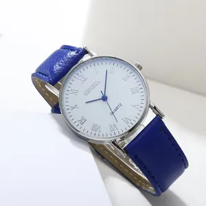 Detail of blue leather strap and silver watch case with Roman numeral dial on white stands