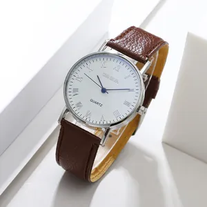 Macro view of Geneva quartz watch featuring a silver case and brown leather strap