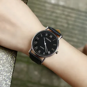 Close-up of Geneva vintage quartz watch with black leather strap and Roman numerals