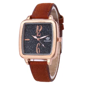 Square rose gold watch with black starry sky dial and brown suede leather strap