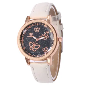 Montre quartz or rose élégante avec cadran papillon étoilé et bracelet en cuir