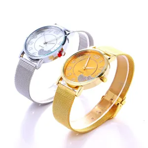 Detail of metal mesh strap women's watches with heart-patterned quartz dials