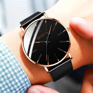 Close-up of Geneva rose gold watch with black dial and mesh strap on a shirt cuff
