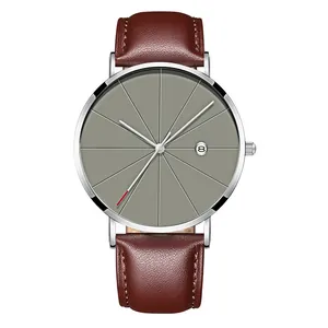 Detail of men's quartz watch showing brown leather strap, grey dial and date window display