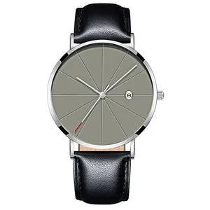 Close-up of minimalist grey watch dial with date window and silver metal casing