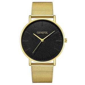 Macro shot of minimalist gold mesh strap watch with black matte dial and Geneva logo