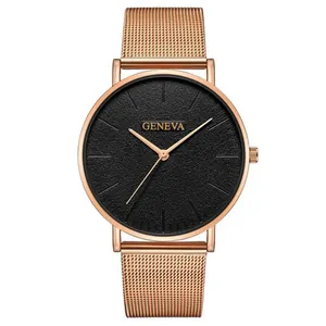 Macro detail of men's quartz watch featuring rose gold case and black textured dial