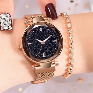 Macro shot of rose gold starry sky watch with magnetic band and rhinestone bracelet