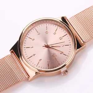 Elegant rose gold mesh strap watch with a round minimalist numeric dial for women