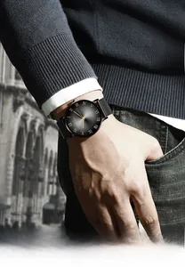 Detail of a men's business quartz watch with Roman numerals and black Milanese strap
