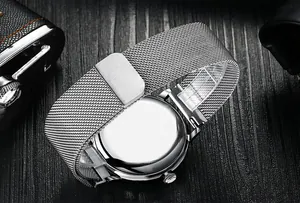 Detail view of the silver Milanese mesh strap and polished stainless steel watch case back