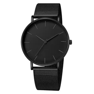 Minimalist all-black quartz watch with mesh metal strap and matte dial displayed on white background