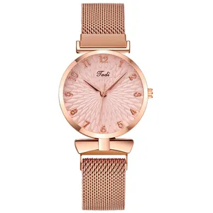 Minimalist women's rose gold quartz watch with pink textured dial and Milanese mesh strap