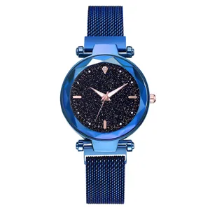 Close-up of starry blue dial with geometric cut glass and magnetic mesh band