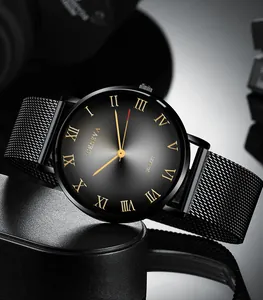 Macro detail of charcoal dial with golden Roman numerals and black mesh strap on watch
