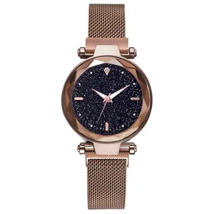 Detail of rose gold starry sky watch face with faceted crystal glass and magnetic strap