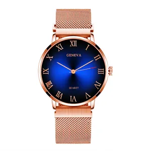 Detail of rose gold mesh strap watch with blue gradient dial and Roman numerals