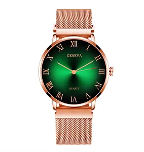 Detail of rose gold mesh band watch with sunburst green dial and Roman numerals
