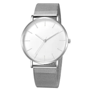 Detail of silver mesh strap and white minimalist watch dial in a polished metal case