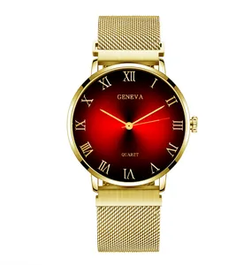 Detail of red gradient dial with Roman numerals and golden stainless steel mesh strap