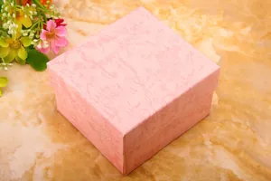 Detailed view of square pink marble-textured gift box for watches and jewelry storage