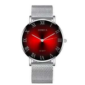 Detail of quartz watch with silver mesh band and red-black gradient sunburst dial