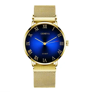 Detail of gold quartz watch with blue sunray dial and Milanese mesh steel strap