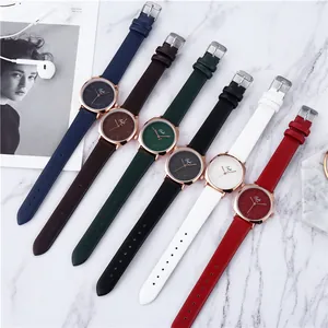 Minimalist quartz watches with PU leather straps in six colors on marble background