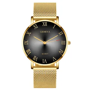 Detail of grey gradient dial with Roman numerals and golden mesh strap on quartz watch